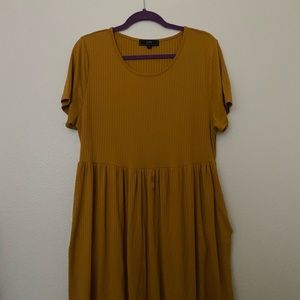 Mustard yellow flowy, a little above the knee dress